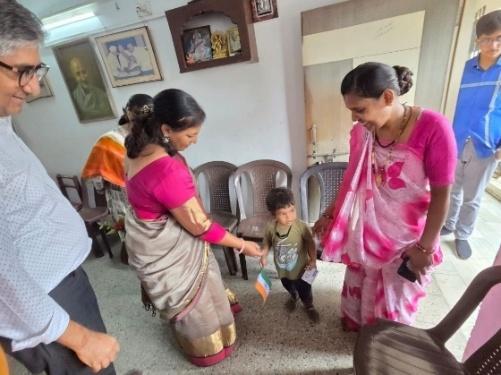 Young children receiving art kits at Shree Vidyalaya