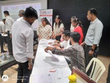 Student providing cheek swab sample for DATRI Registry