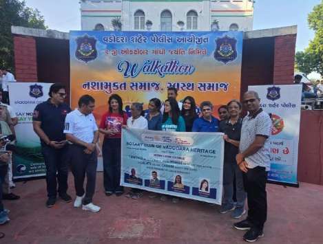Police Commissioner Shri Narasimha Komar, IPS and dignitaries with banner