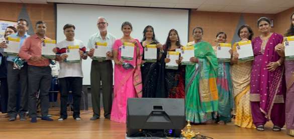 Finalists, judges, and club officers with trophies and certificates on stage