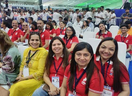 RCBS members in red polo shirts at the Prime Minister reception