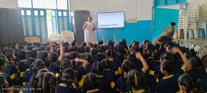 School children actively raising hands and responding