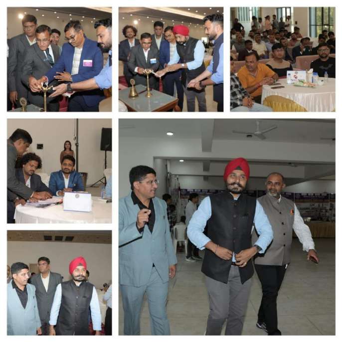 Dignitaries lighting lamp and addressing industrialists