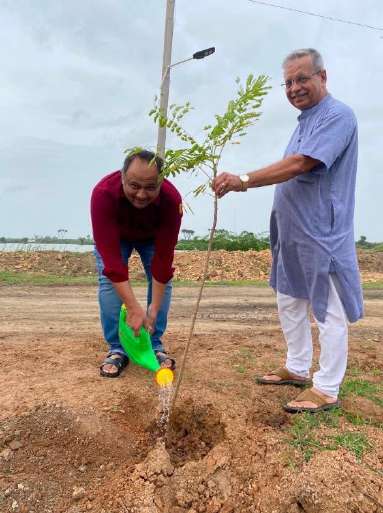 Members nurturing newly planted sapling