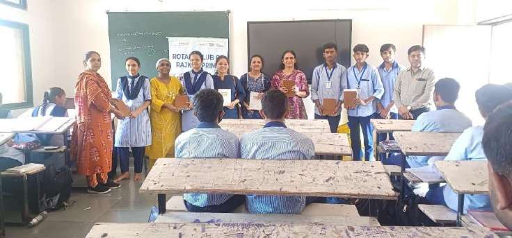 Government school students holding distributed diaries