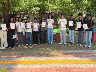 Students lined up with study materials