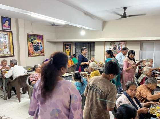 Serving meals to elderly residents at Vrudhashram Junagadh