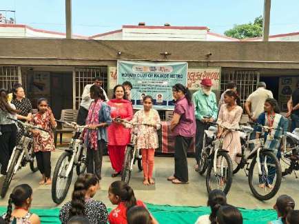 School assembly and beneficiaries with their bicycles