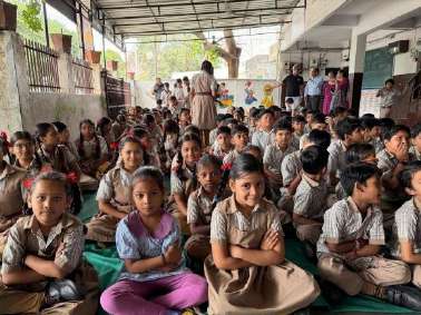 Students holding colorful nets with smiles