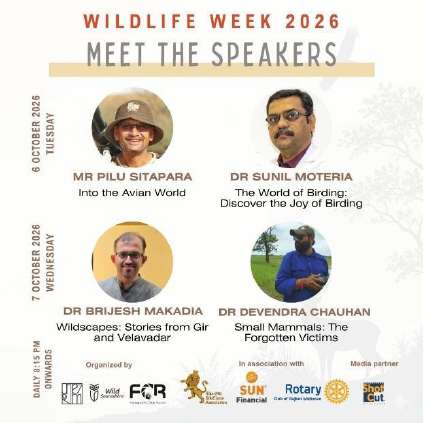 Auditorium packed with attendees, photographers, and naturalists