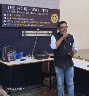Speaker at podium during Rotary exchange meeting