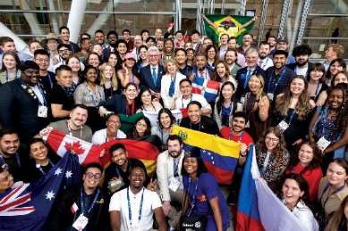 Convention crowd and delegates celebrating fellowship